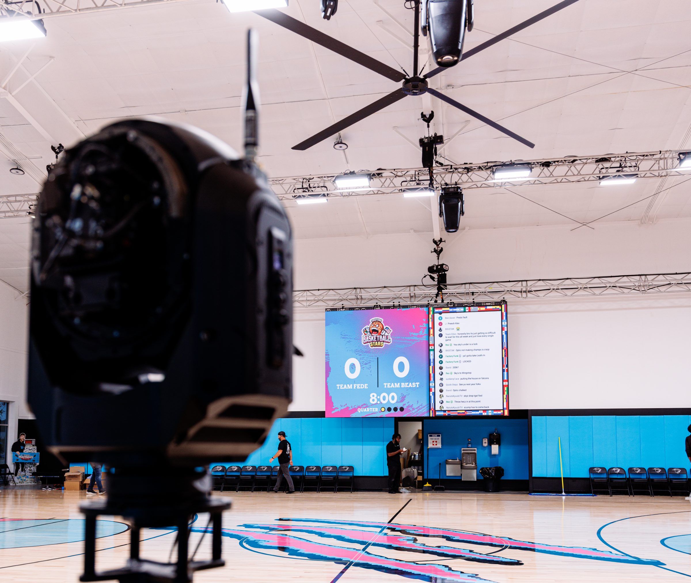 Broadcast camera facing the Beast Arena scoreboard before the MrBeast vs. Fede basketball livestream