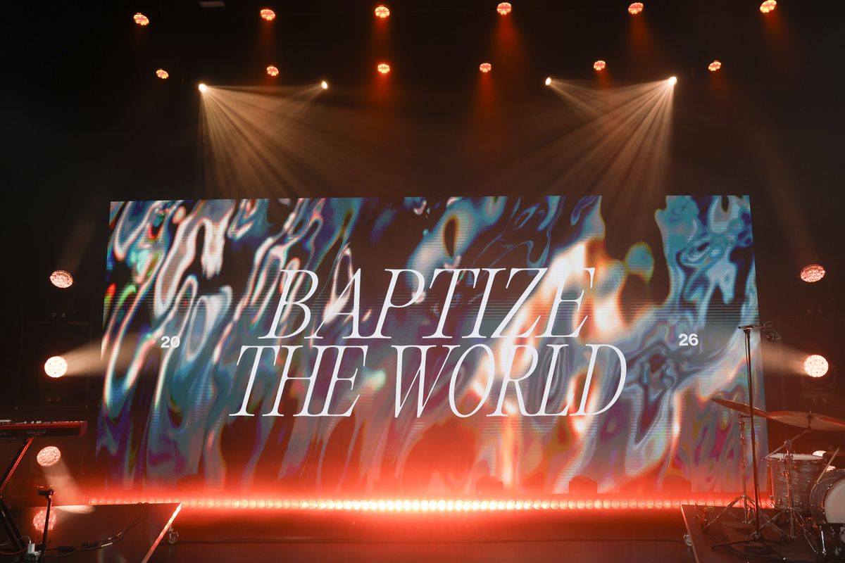 The World Stage Theater set for Baptize the World — the LED wall reading Baptize the World under the lighting rig
