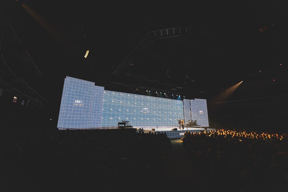 The 105-foot transparent upstage wall lit, with the LED floor and the room in front of it