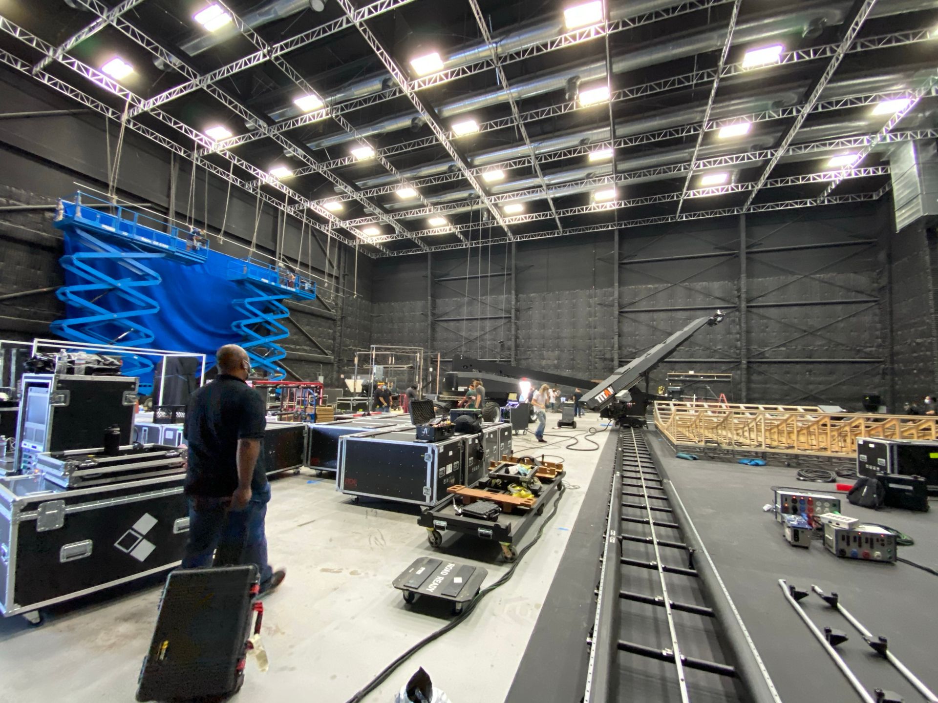The studio stage during the build, with a technocrane and road cases on the floor