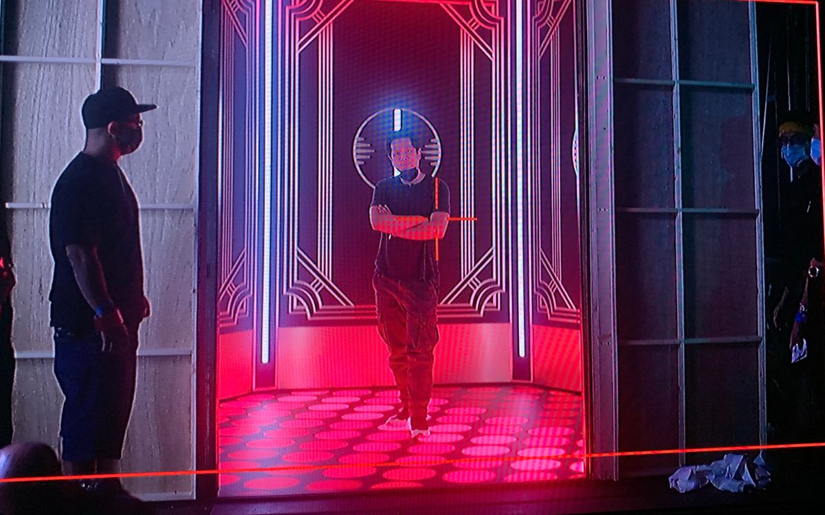 The elevator on the director's monitor — LED floor at its base and red LED strips set into the wall panels