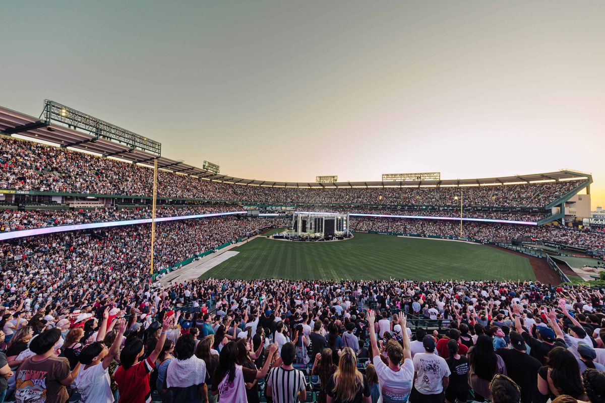 Angel Stadium high and wide at dusk, full to the upper deck, during the SoCal Harvest Crusade