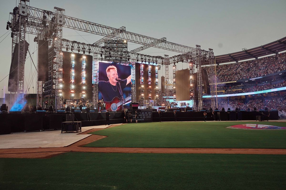 The Angel Stadium stage from the field — IMAG on the LED screens between the truss towers, Harvest Crusade 2024