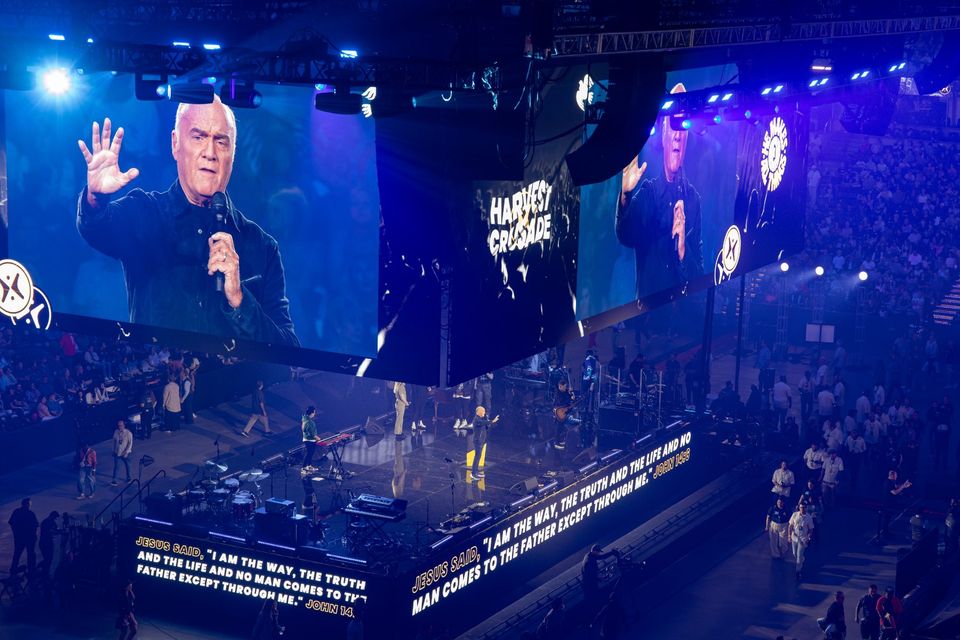 Greg Laurie on the LED screens with the scripture ribbon along the stage front, Harvest Crusade 2023 at Honda Center