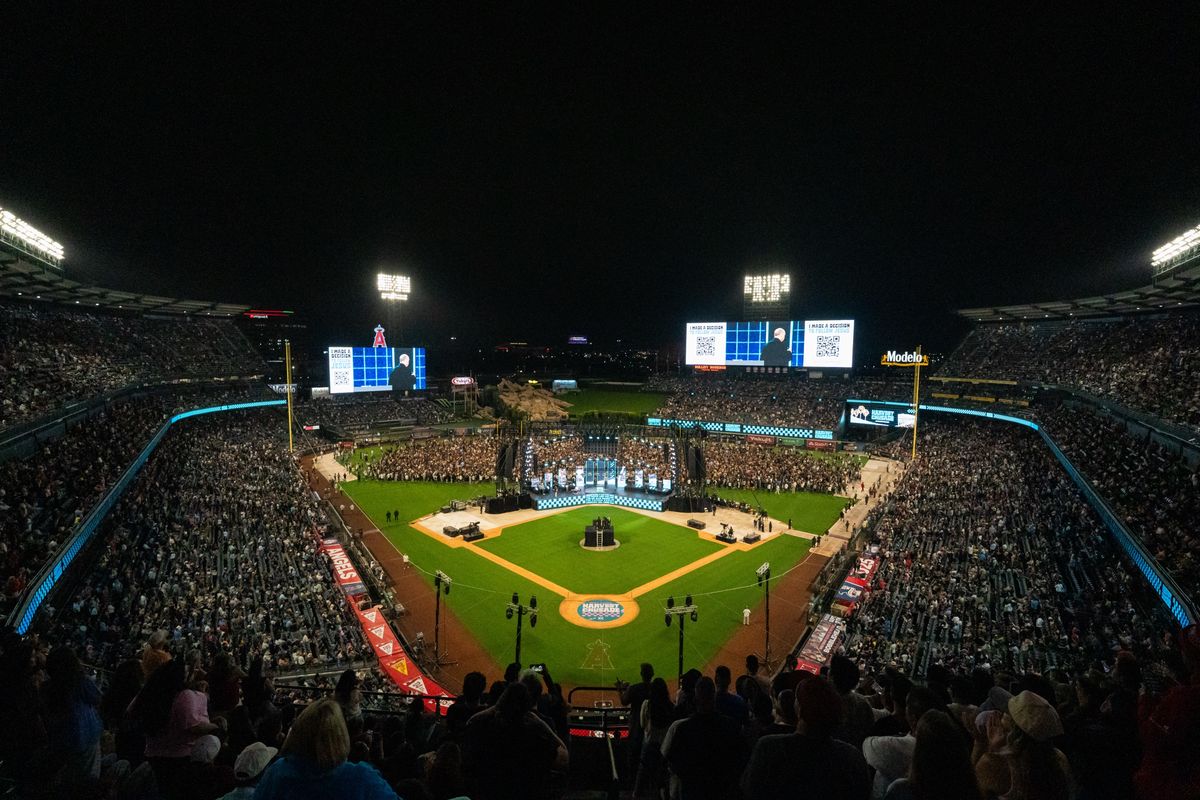Angel Stadium at night from the upper deck during Harvest Crusade 2025, both outfield LED screens lit