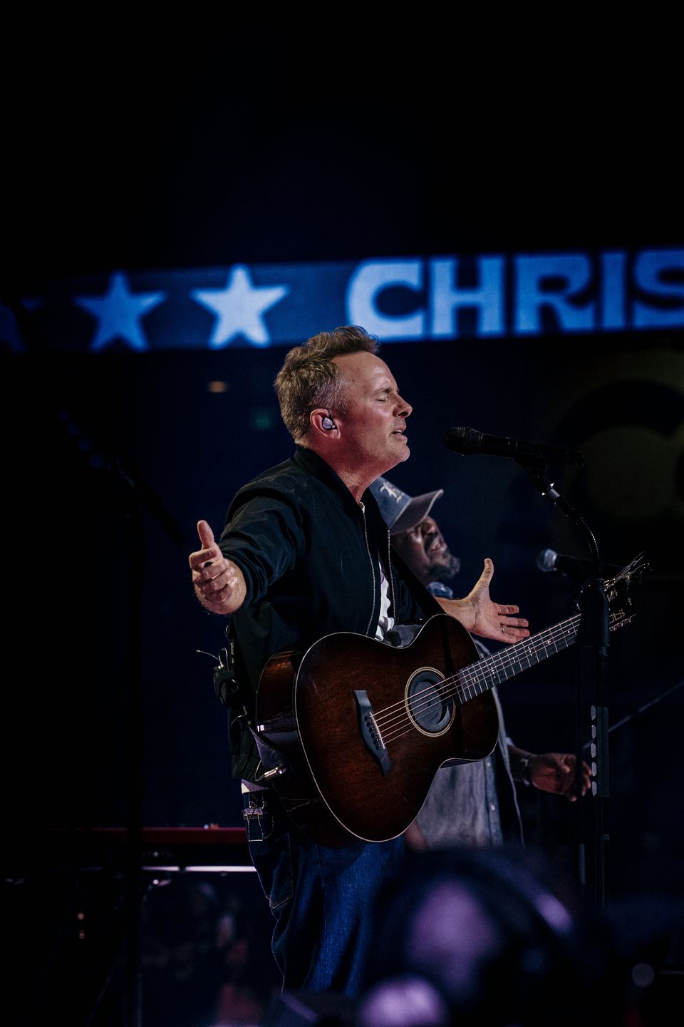 Chris Tomlin singing with the CHRIST LED behind him at the UCCU Center, Utah Valley 2025