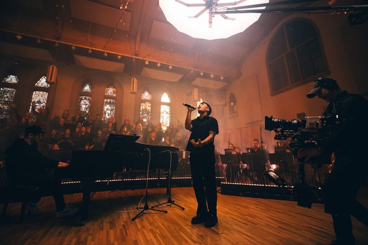 Camera operator at the edge of the stage