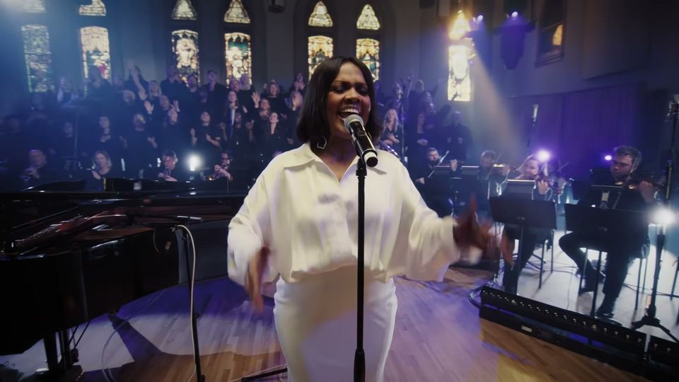 CeCe Winans in the chapel at Ocean Way Nashville, stained glass and the choir behind her