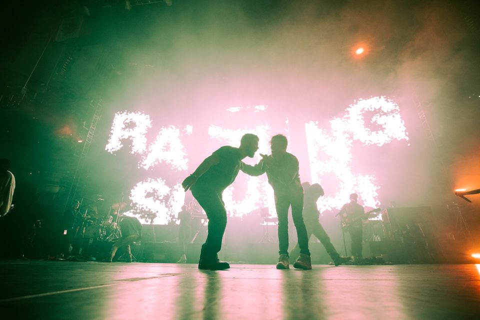 Performers silhouetted against a full-stage LED wall at Elevation Nights, Toronto