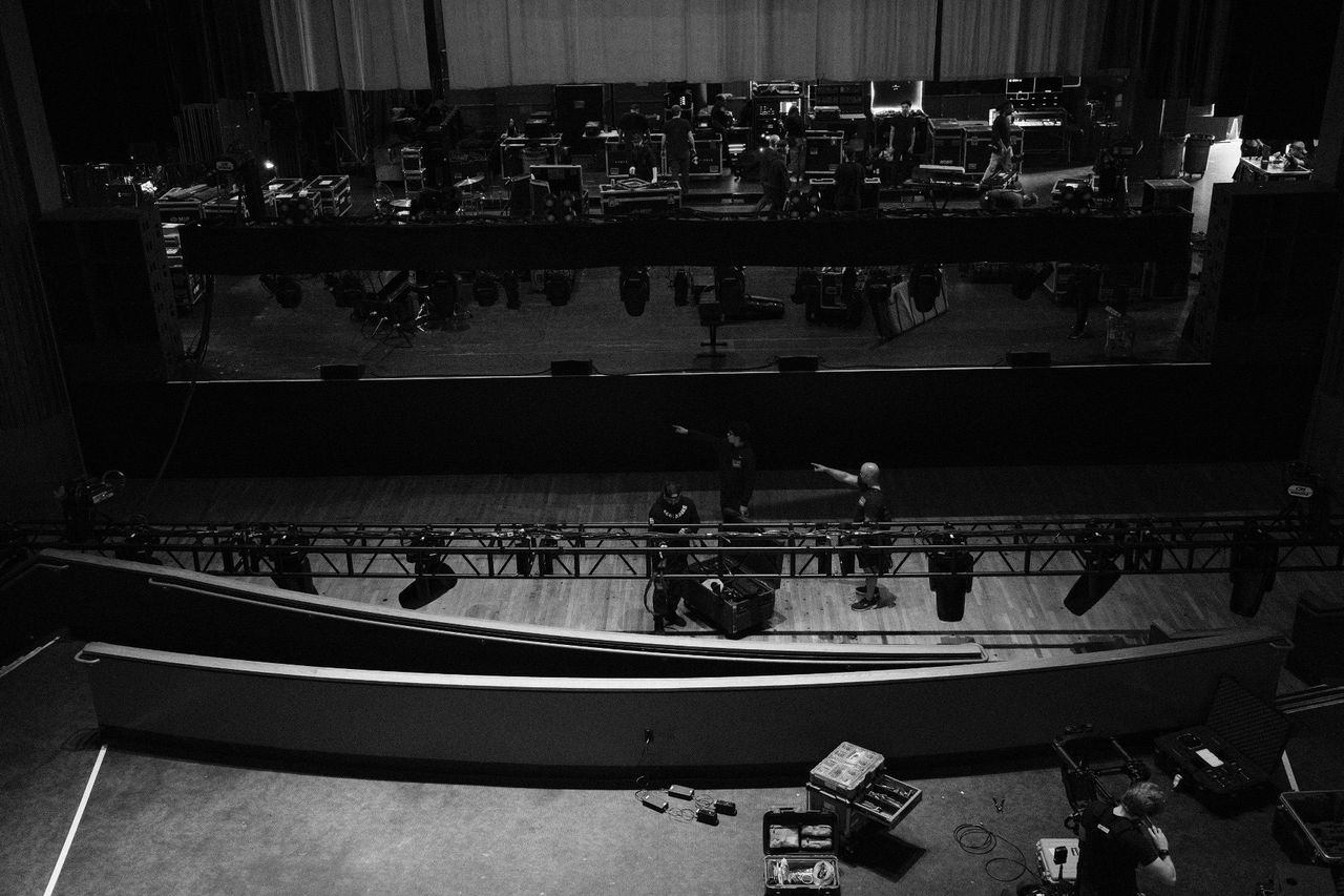 Load-in at The Wiltern — road cases on stage, truss on the floor