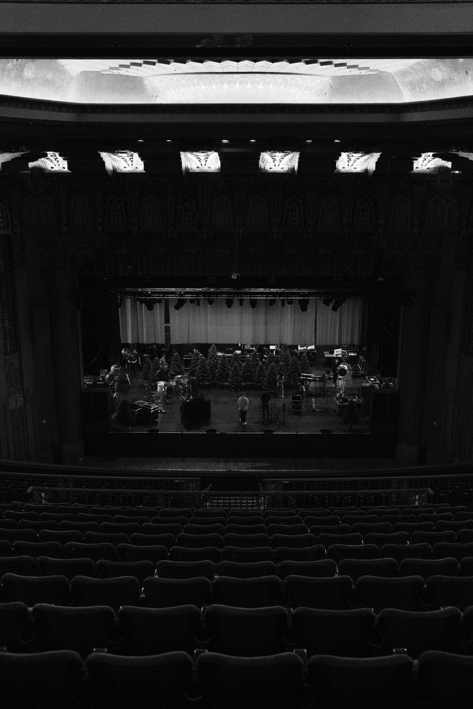The Wiltern from the balcony — Christmas trees on stage during the build